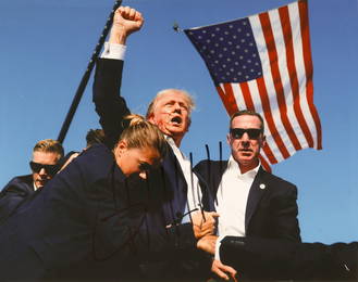DONALD TRUMP SIGNED PHOTOGRAPH OF HIS WOUNDING BY AN ASSASSIN