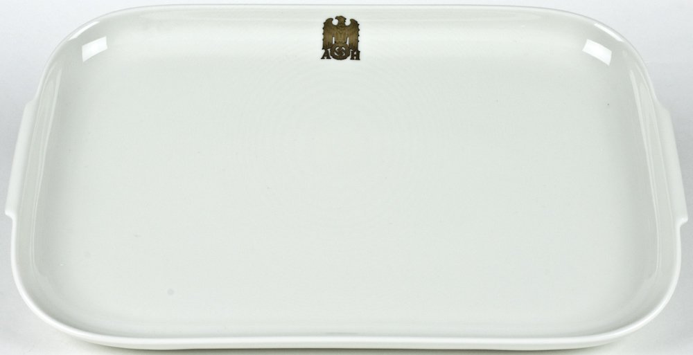ADOLF HITLER ALLACH SERVING PLATTER: A rare piece of Allach porcelain dinnerware manufactured exclusively for Adolf Hitler in the SS-operated Allach porcelain factory at the notorious concentration camp at Dachau. This rectangular servin