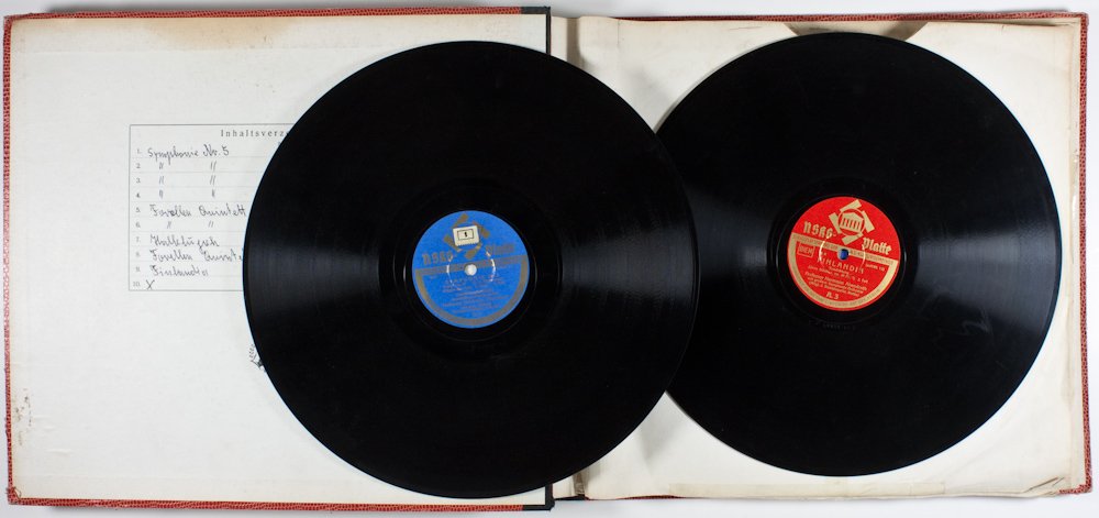 NAZI NSKG RECORD ALBUMS: A collection of nine Nazi NSKG (National Socialist Culture Community) records, housed in the original binder. The records feature performances of symphonies conducted by German conductor Hermann Abend