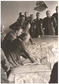 ADOLF HITLER AT HIS MAP TABLE