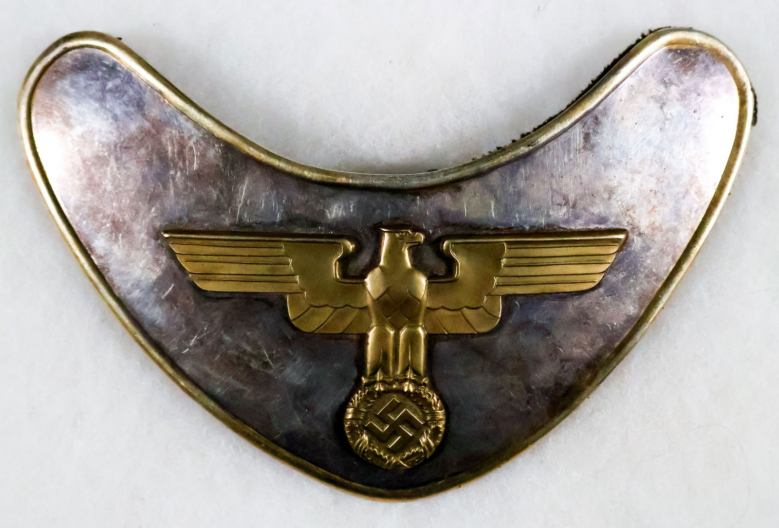 SS STANDARTE FELDHERRENHALLE GORGET: Third Reich gorget, 6.5 x 4.25 in., as worn by members of the SA-Standarte ‘Feldherrnhalle’, the honor guards at the Feldherrnhalle in Munich. The kidney-shaped gorget is constructed from