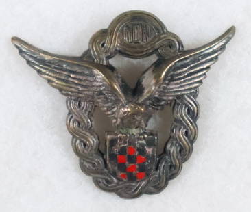 (CROATIA) CROATIAN AIR FORCE PILOT'S BADGE, 1ST MODEL: Extremely rare Croatian Pilot&#8217;s Badge, First Model in silvered tombac, 74 mm (w) x 63 mm (h) of hollow construction with two vent holes, one each at top and bottom. This first model badge used t