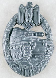 GERMAN PANZER BADGE IN SILVER: World War II German Panzer Badge, stamped zinc hollow back construction 2.35 in. tall with straight pin and round wire catch, both a soldered sheet metal hinge, and soldered catch plate to reverse. Un