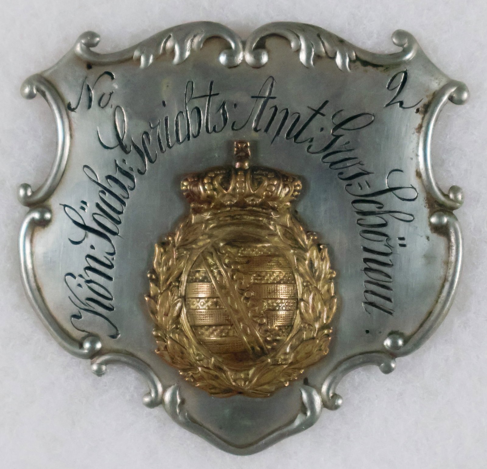 SAXON COURT OFFICER’S BADGE: Saxon Court Officer's Badge, 3.25 x 3.25 in., with German text classifying it as being for a court officer and the numerical designation ‘No. 2’. The text surrounds a coat of arms, likely 