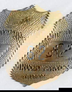 U.S. MILITARY POLICE BADGE: U.S. Army Military Police badge, ca. 1930-40, stamped brass 23/4 in., vaulted, with vertical pin back. One spot of surface corrosion.