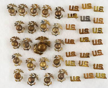 MARINE CORPS COLLAR INSIGNIA: Good dealer's lot of approx. 70 brass globe and anchor and 100 'U.S.' Marines collar devices, all ca. World War II, all lacking clutches. Good to very good.