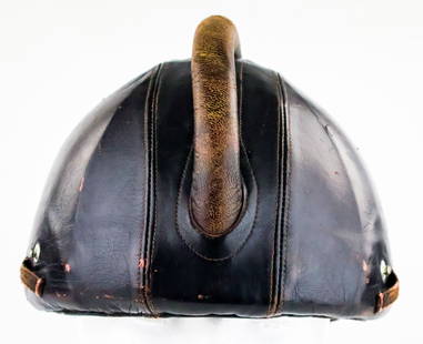 ‘FLIEGERSTAHLHELM’ ARMORED GLIDER CORPS FLIGHT HELMET: An excessively rare piece of Luftwaffe flight gear, a ‘Fliegerstahlhelm’, or armored flight helmet, used on a very limited basis by NSFK glider pilots pre-war and during the war. The dark
