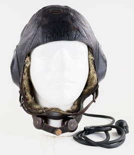 LUFTWAFFE LKPW101 WINTER HELMET: An intact and attractive Luftwaffe LKPW101 Fliegerkopfhaube for winter. The helmet is lined in both sheepskin and rabbit skin and includes the original tag which has a large stain obscuring most of