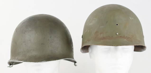 WORLD WAR II AMERICAN M1 HELMET: World War II American M1 helmet, green textured paint finish about 75% intact, more worn towards the rear, overpainted long ago. Swivel bale, stainless steel binding with seam at the front, the rim a