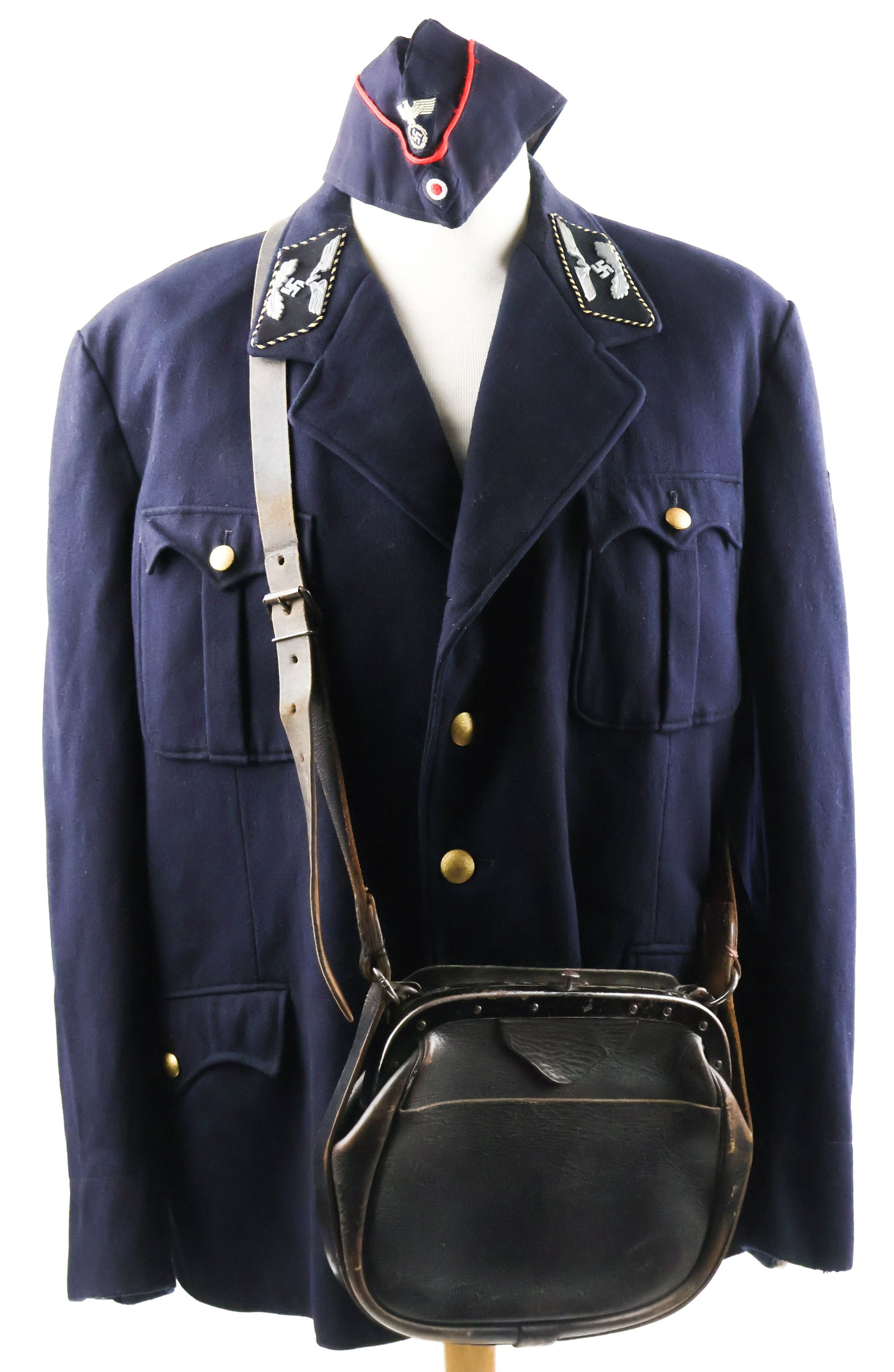 DEUTSCHE REICHSBAHN OFFICIAL TUNIC: A navy-blue tunic worn by a member of the Deutsche Reichsbahn in the 11th pay grade, most likely for a Reservelokomotivfuhrer, Wagenmeister, Signalwerkfuhrer, Telegrafenwerkfuhrer, Werkfuhrer, or Reic