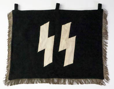 SS DOUBLE-SIDED TRUMPET BANNER: Very rare SS trumpet banner, heavy woven wool construction 22 x 18.75 in., depicting white sig runes on one side and an unusual abstract jawless Totenkopf and crossbones on the other. The emblems are