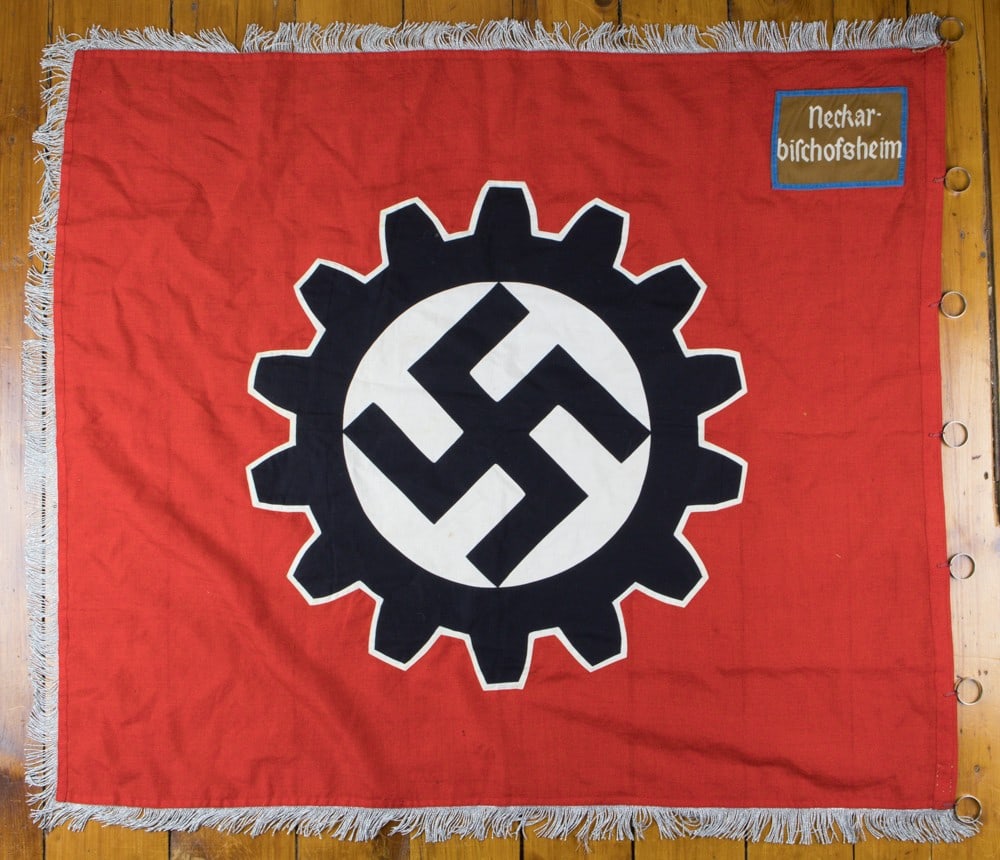 D.A.F. PARADE FLAG: A 1937 pattern, 52 x 46 in. double-sided, multi-piece cotton construction factory unit parade flag, trimmed to all but the hoist edge in 2.25 in. long twisted silver/aluminum wire fringe. The flag fea