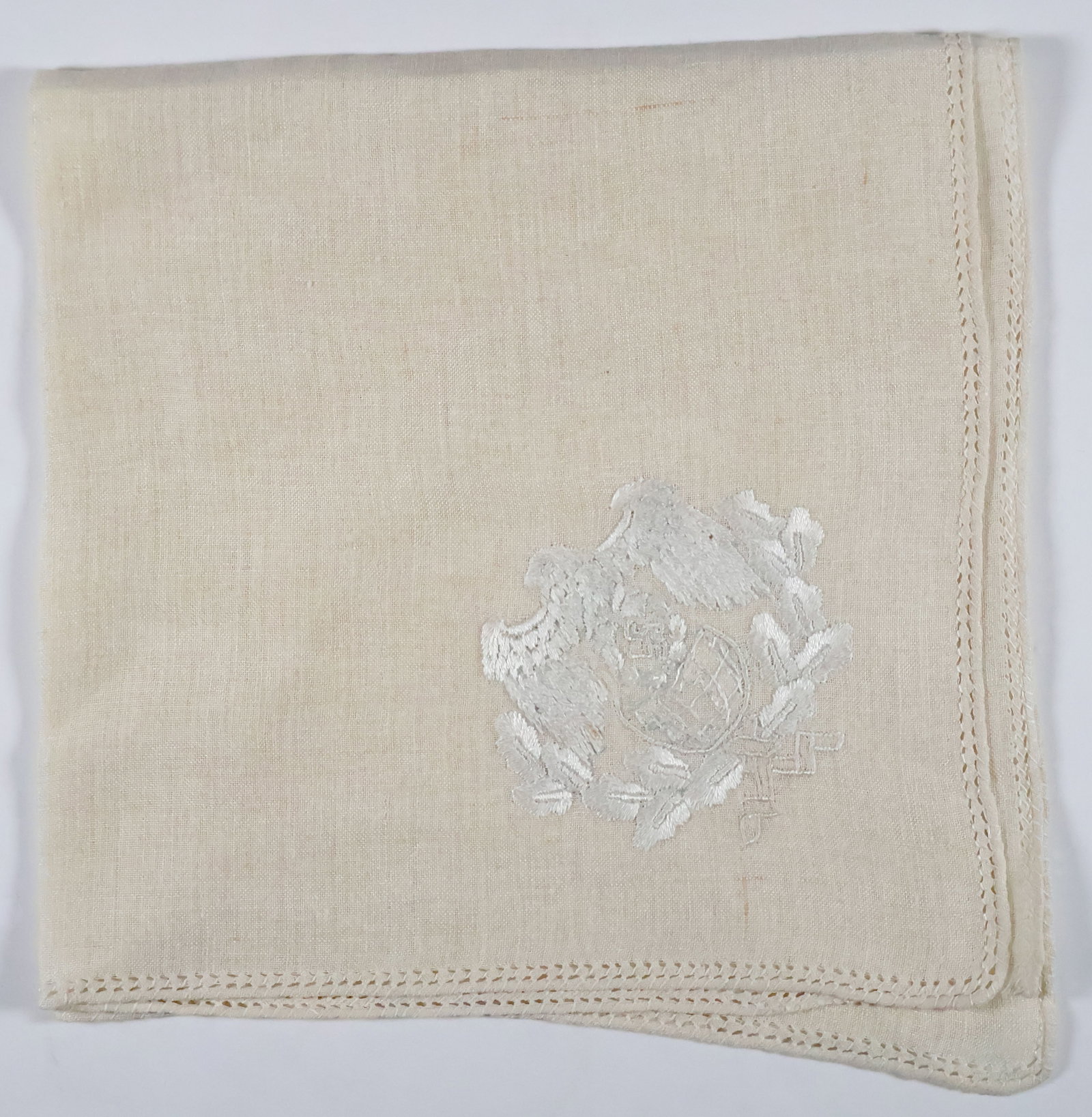JOACHIM VON RIBBENTROP FORMAL LINEN NAPKIN: A fine beige linen lunch napkin once part of a set owned and used by JOACHIM VON RIBBENTROP (1893-1946), German politician and diplomat who served as Minister of Foreign Affairs of Nazi Germany from 1