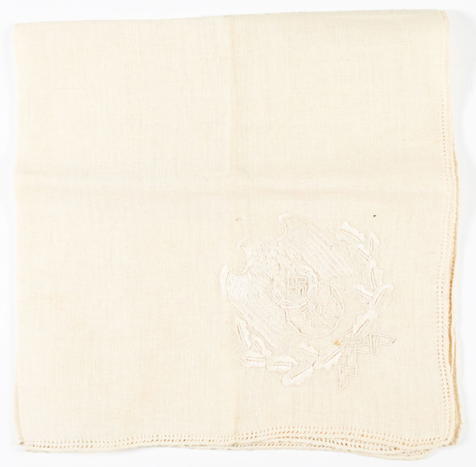 JOACHIM VON RIBBENTROP FORMAL TABLE NAPKIN: JOACHIM VON RIBBENTROP (1893 - 1946) Nazi foreign minister. First of the Nuremberg defendants to hang on October 16, 1946. A fine von Ribbentrop relic, an embroidered cream-colored linen napkin once o