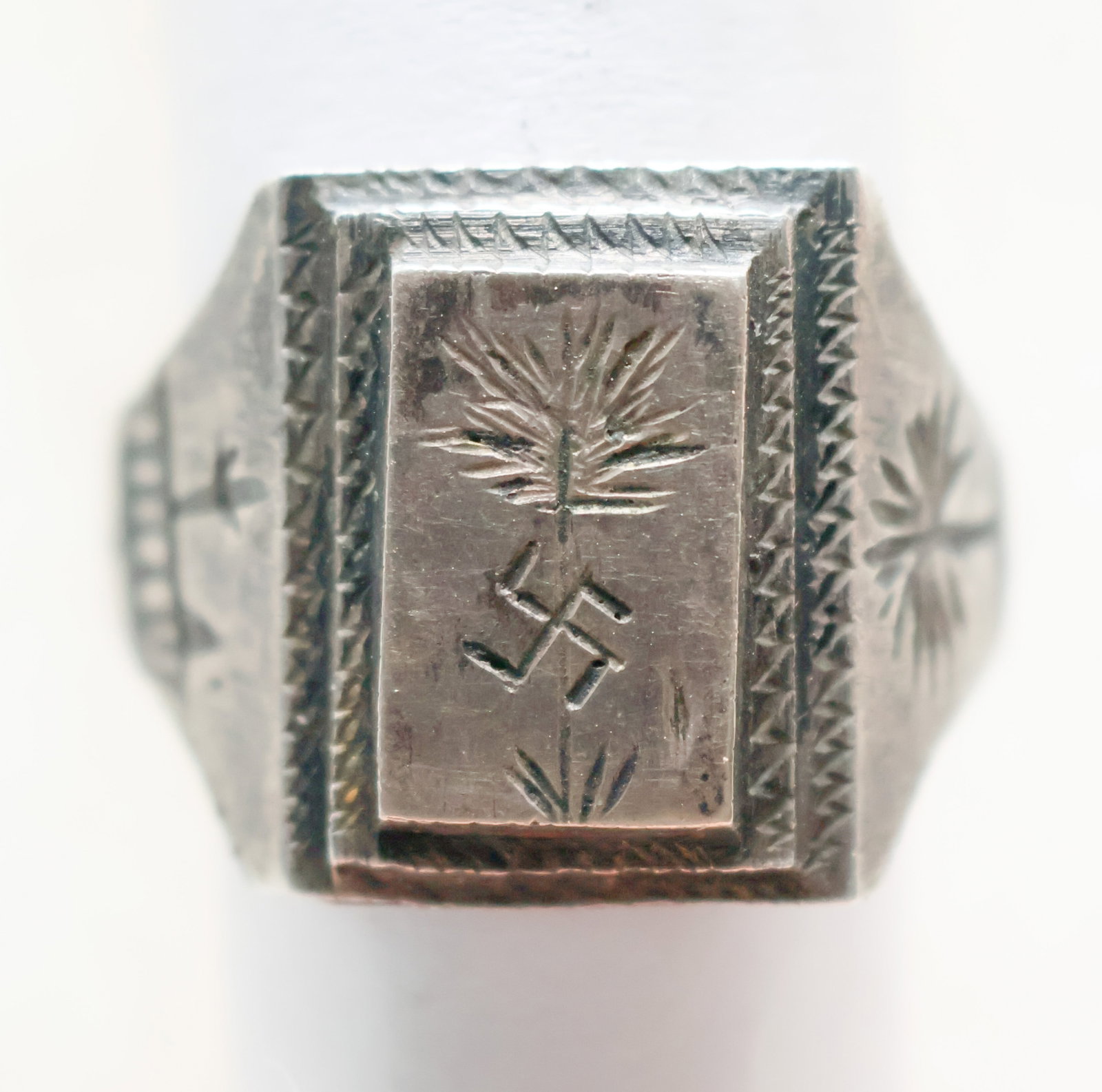 AKRIKA CORPS ENGRAVED SILVER RING: An exceptional and absolutely period, authentic Afrika Corps sterling silver soldier's ring. The ring has a stepped pedestal face with an engraved depiction of the emblem of the Afrika corps, e palm t