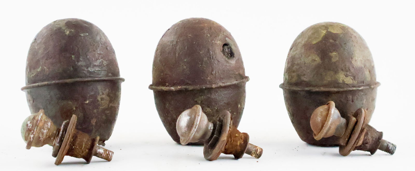 GERMAN M-39 'EGG' HAND GRENADES (3): Lot of three German M-39 Eierhandgranate, or 'egg hand grenade', with fuses, all in dug condition from an unknown battlefield.