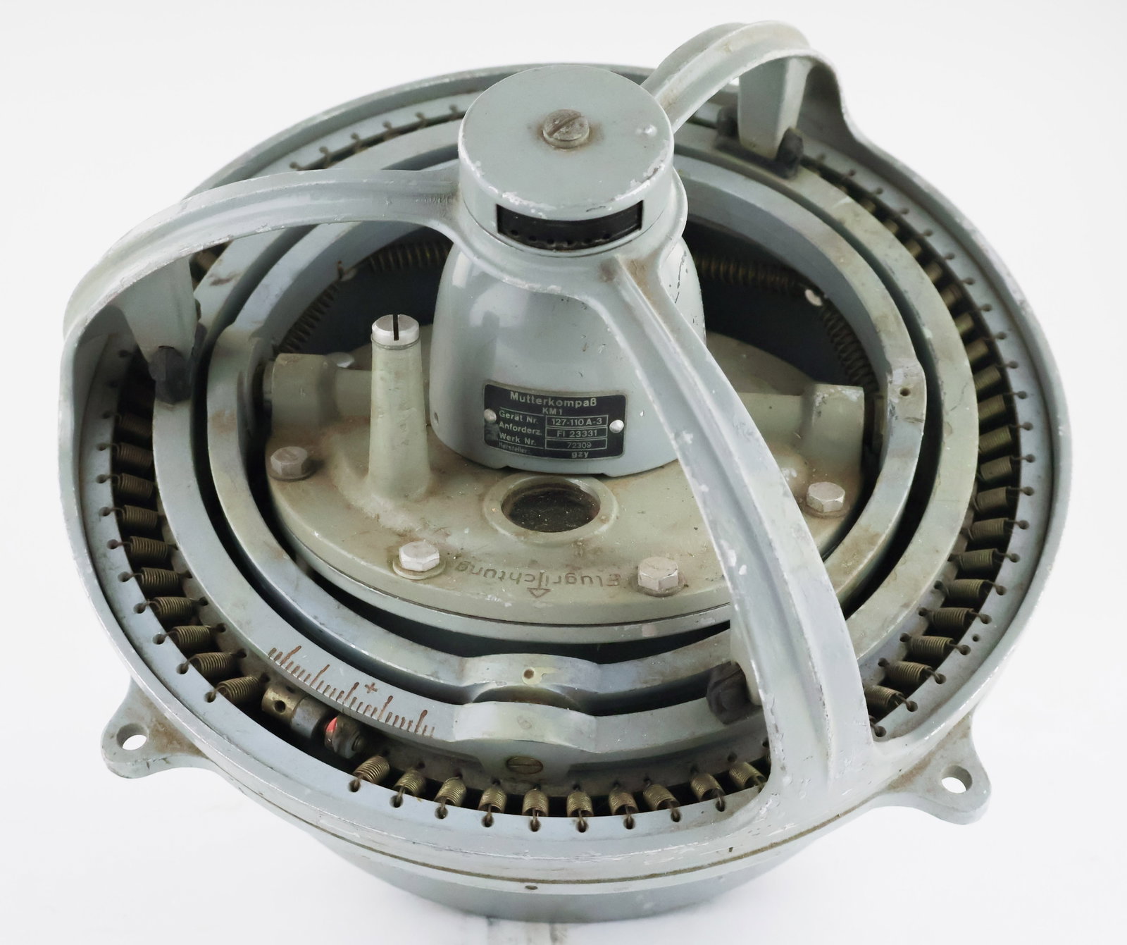 LUFTWAFFE MUTTERKOMPASS ON THE ORIGINAL GIMBAL MOUNT: A master compass used in the Messerschmitt bf 109, M 292, and FW 190 fighter aircraft. This compass would be placed in the rear of the fuselage and would feed information electronically to the control