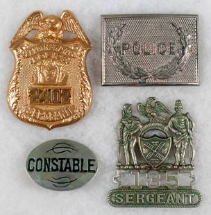 POLICE BADGES AND BUCKLE (4): Lot of four police badges and a belt buckle, includes: City of New York Police Sergeant's badge, ca. 1940s City of New York Sergeant's hat badge, a small hole at bottom of the shield, no attaching dev