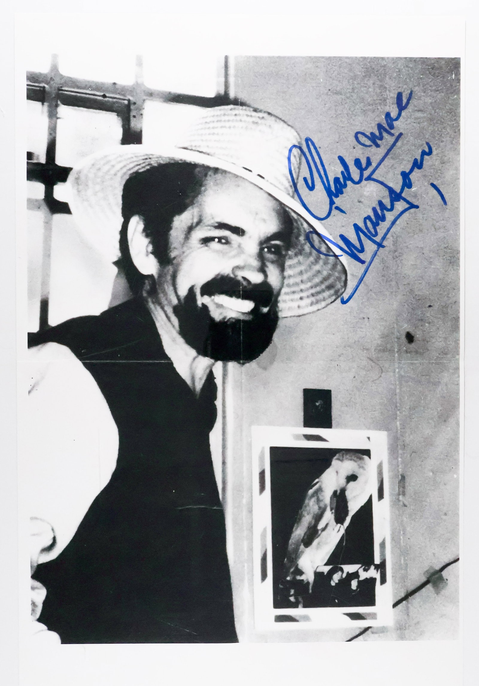 CHARLES MANSON: (1934 - 2017) Drifter whose 'family' committed the infamous Tate-LaBianca murders in 1969. Disturbing oversize S.P. 'Charles Mac Manson' in blue marker and adding a swastika as usual, 11 x 17 in. b/w,