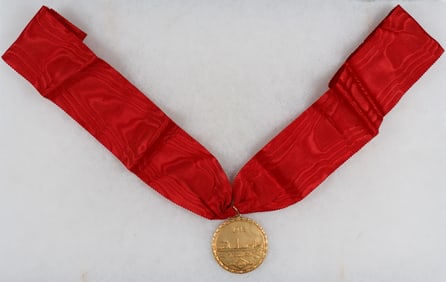 GOLD MEDAL GIVEN TO THE FAMILY OF A K.I.A. MERCHANT SAILOR