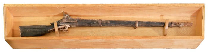 A STILL-LOADED CONFEDERATE ENFIELD FOUND BURIED WITH ITS OWNER