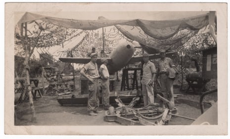 MARINES INSPECT AN ‘OHKA’ SUICIDE AIRCRAFT ON OKINAWA
