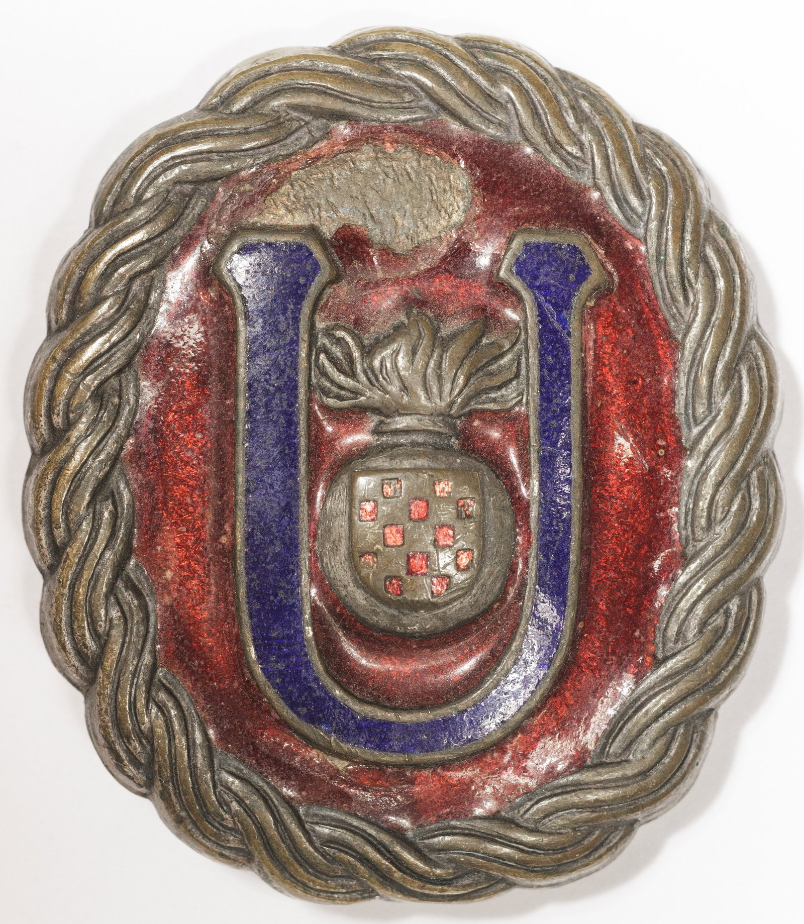 INDEPENDENT STATE OF CROATIA USTASE OFFICER’S BELT BUCKLE: Rare World War II-era belt buckle, 1.75 x 2.25 in., worn by officers of the Ustase, the ruling party of the Independent State of Croatia. The oval buckle is constructed of silvered tombac, die-stamped