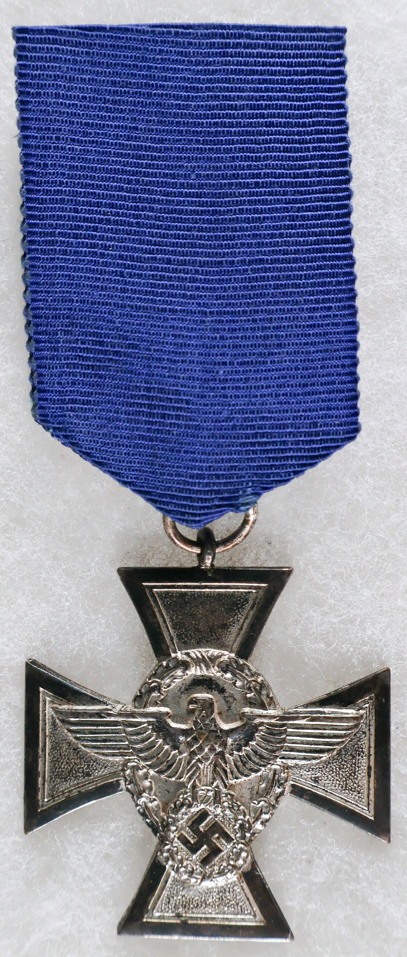'ORPO' 18-YEAR LONG SERVICE AWARD: German Ordnungspolizei ('Orpo') 18-Year Long Service Award, silvered bronze, a Maltese Cross with pebbled arms, the obverse bearing a raised Ordnungspolizei insignia in the form of an oval oak leaf wr