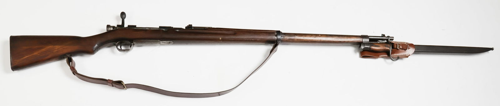 JAPANESE TYPE 38 RIFLE: Early Japanese Type 38 'Arisaka' infantry rifle, 30.25 in. barrel, 50 in. overall, 6.5x50mm. Manufactured by the Koishikawa arsenal at Tokyo, no series mark, serial number 453789. Receiver ring marked