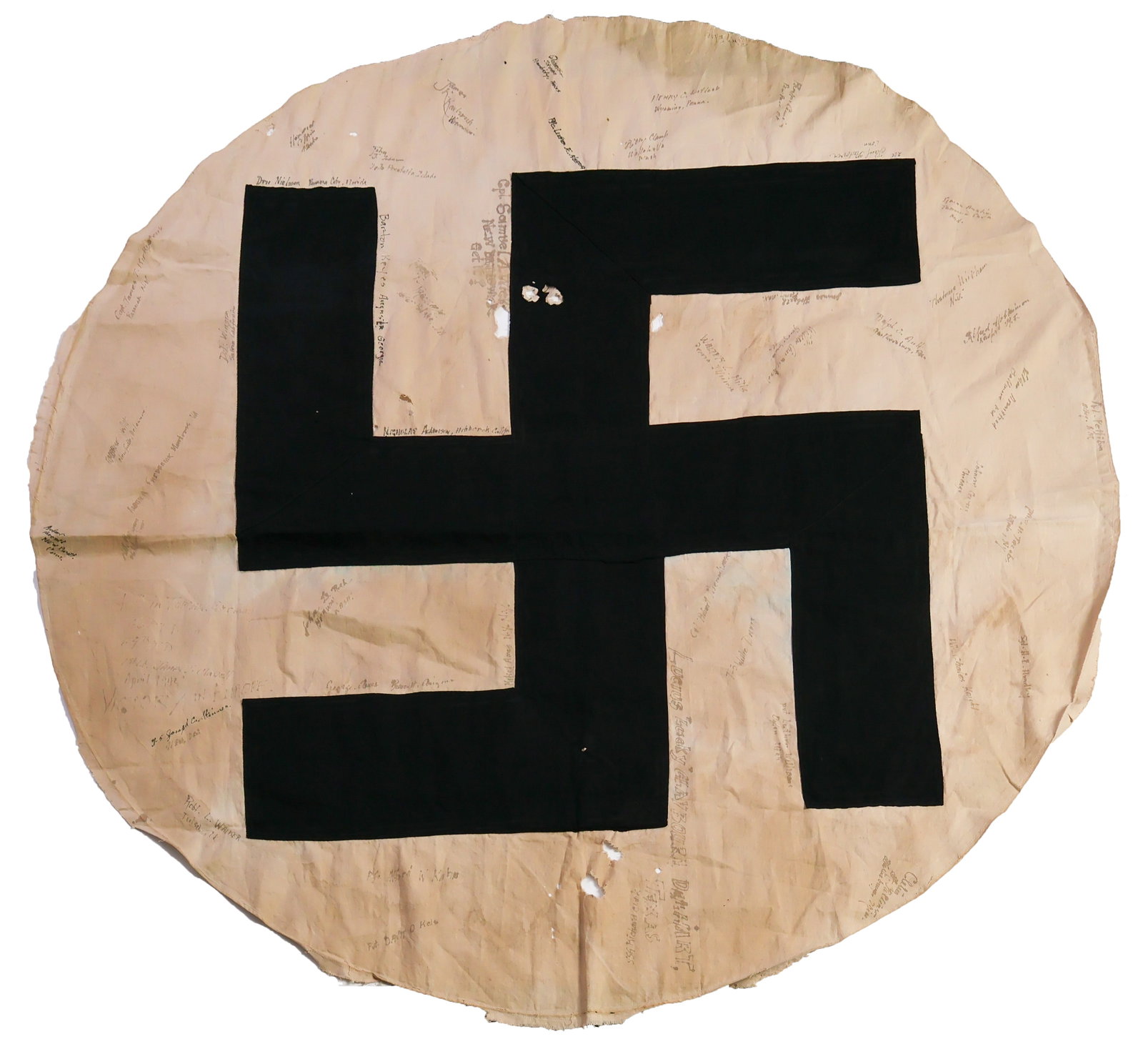 SIGNED NAZI FLAG FROM THE FIRST CONTACT AT TORGAU: A most historic signed flag relic, the roundel (white circular field and swastika) taken taken from a large garrison NSDAP garrison flag believed to have been captured at Torgau, Germany on the Elbe R