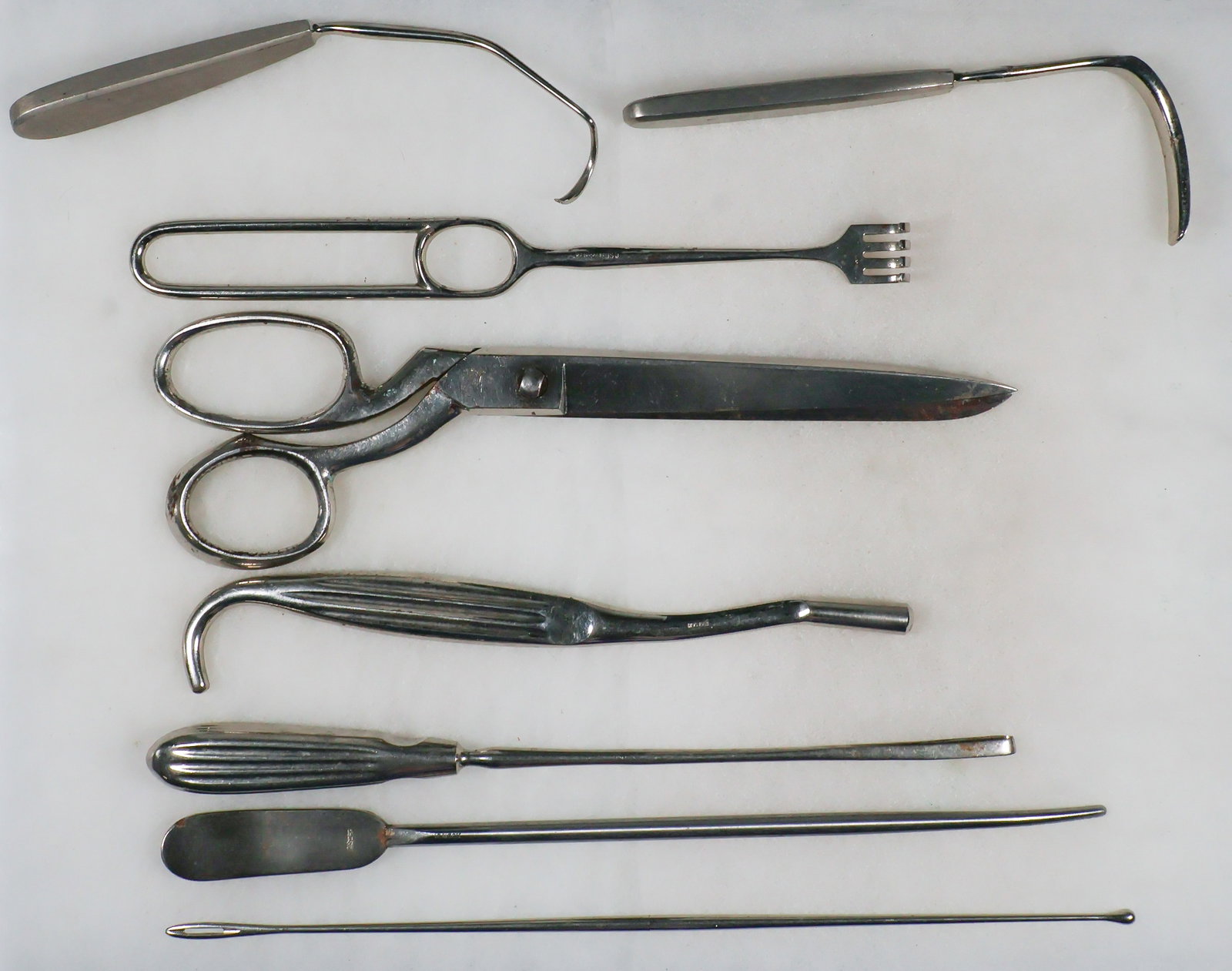 (SIEGE OF BASTOGNE) AMERICAN SURGICAL INSTRUMENTS (6): A fine set of six various stainless steel surgical tools recovered by locals from the hospital site of the 326th Airborne Medical Co., 101st Airborne Division near Barriere Hinck in Sainte Ode, Belgiu