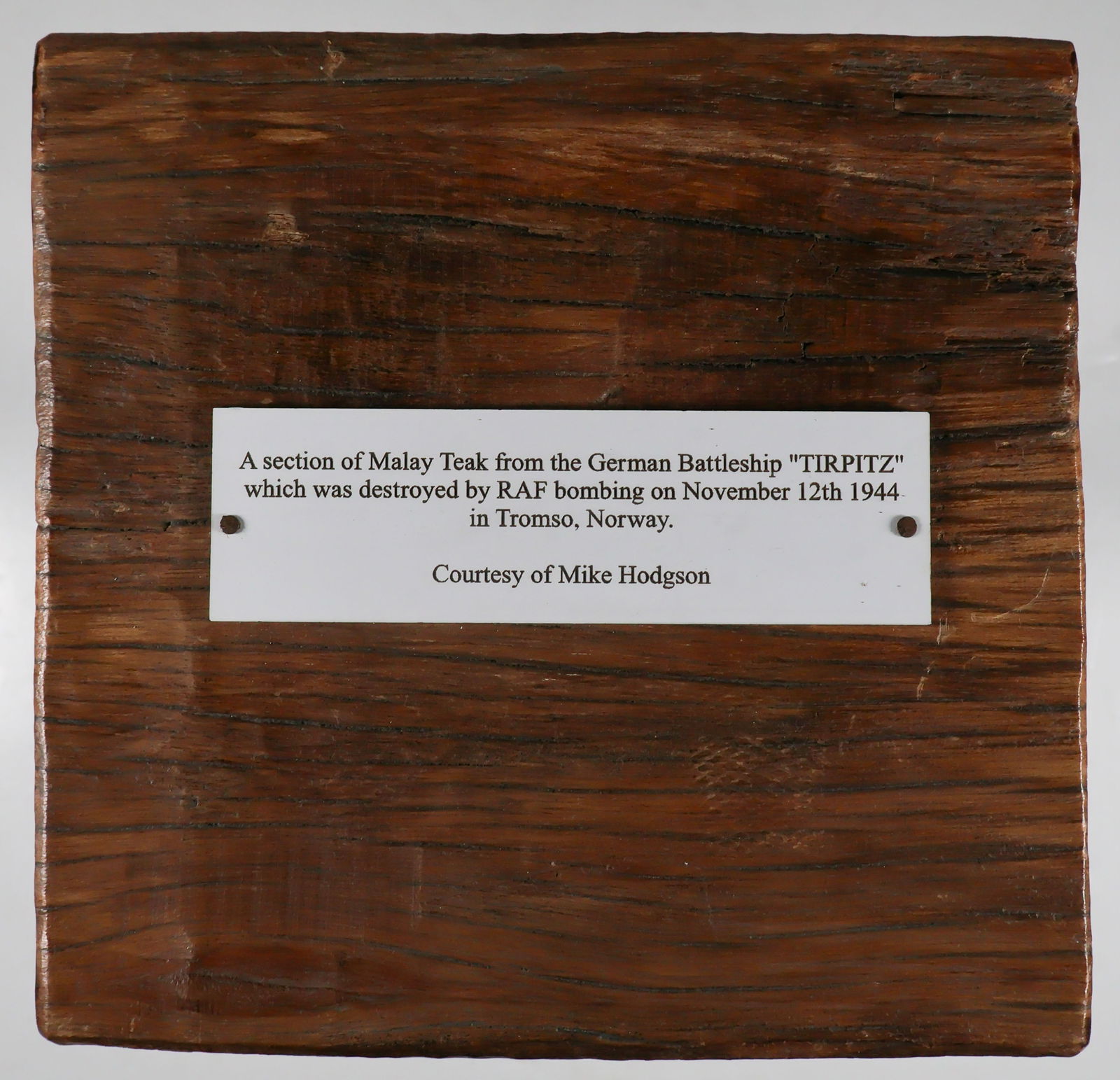 BATTLESHIP 'TIRPITZ' DECKING RELIC: A square section of teak decking recovered from ill-fated battleship TIRPITZ, sister ship of the BISMARCK which was sunk by British air attack in Norway on Nov. 12, 1944. The relic measures 5.75 in. x