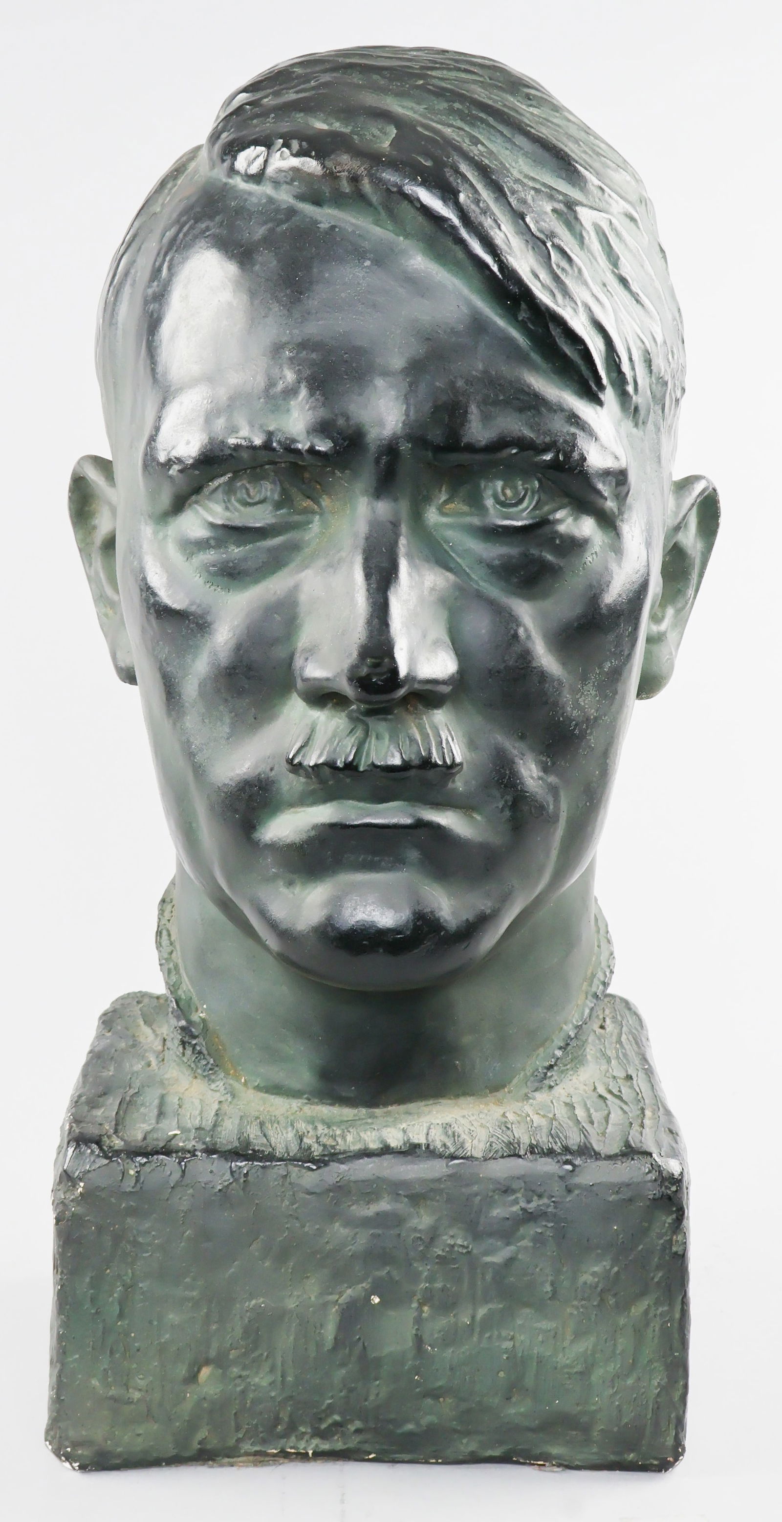 PLASTER PAINTED BUST OF ADOLF HITLER: Excellent plaster cast of a bust of Adolf Hitler as undertaken by German sculptor WALTER WOLFF (1887-1966), 19 in. tall, 9 in. wide, signed on back of neck, 'W Wolff 33'. The painting of the bust is o
