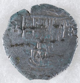 TWO REALE SILVER COIN FROM ATOCHA, WITH MEL FISHER CERTIFICATE