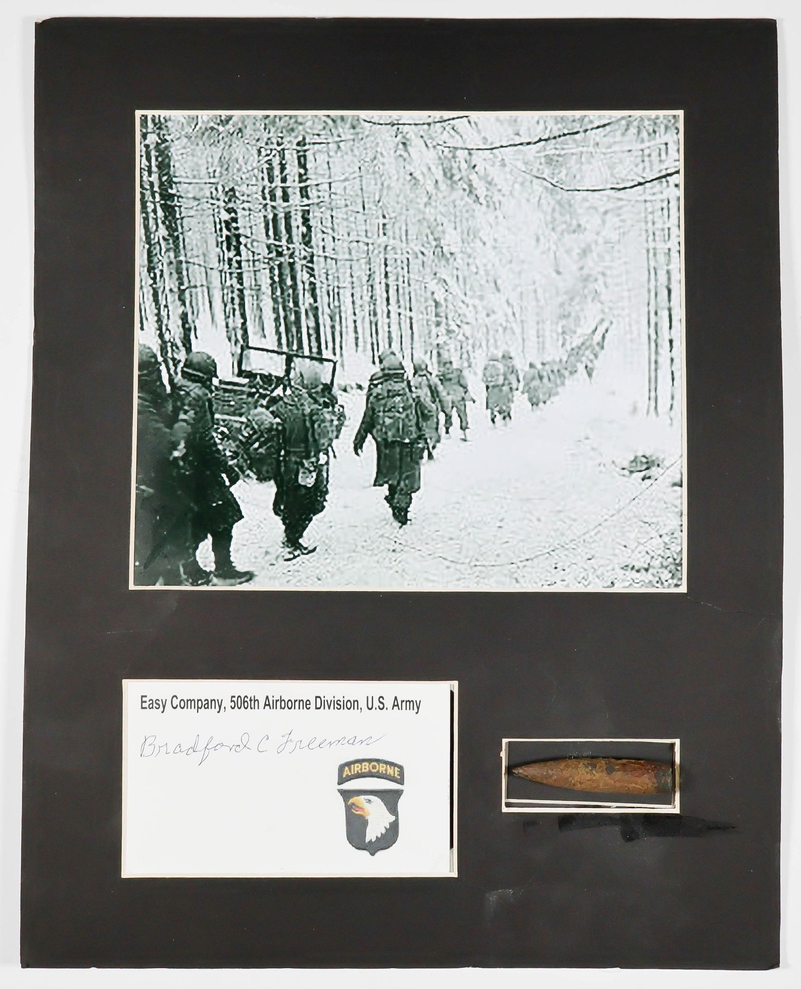 'BAND OF BROTHERS' SIGNED PIECES (9): Grouping of items signed by members of the 506th P.I.R., commonly called the 'Band of Brother', all signed postwar. Included is: an 8 x 10 in. photo of 506 PIR men at Upottery Airfield on the eve of