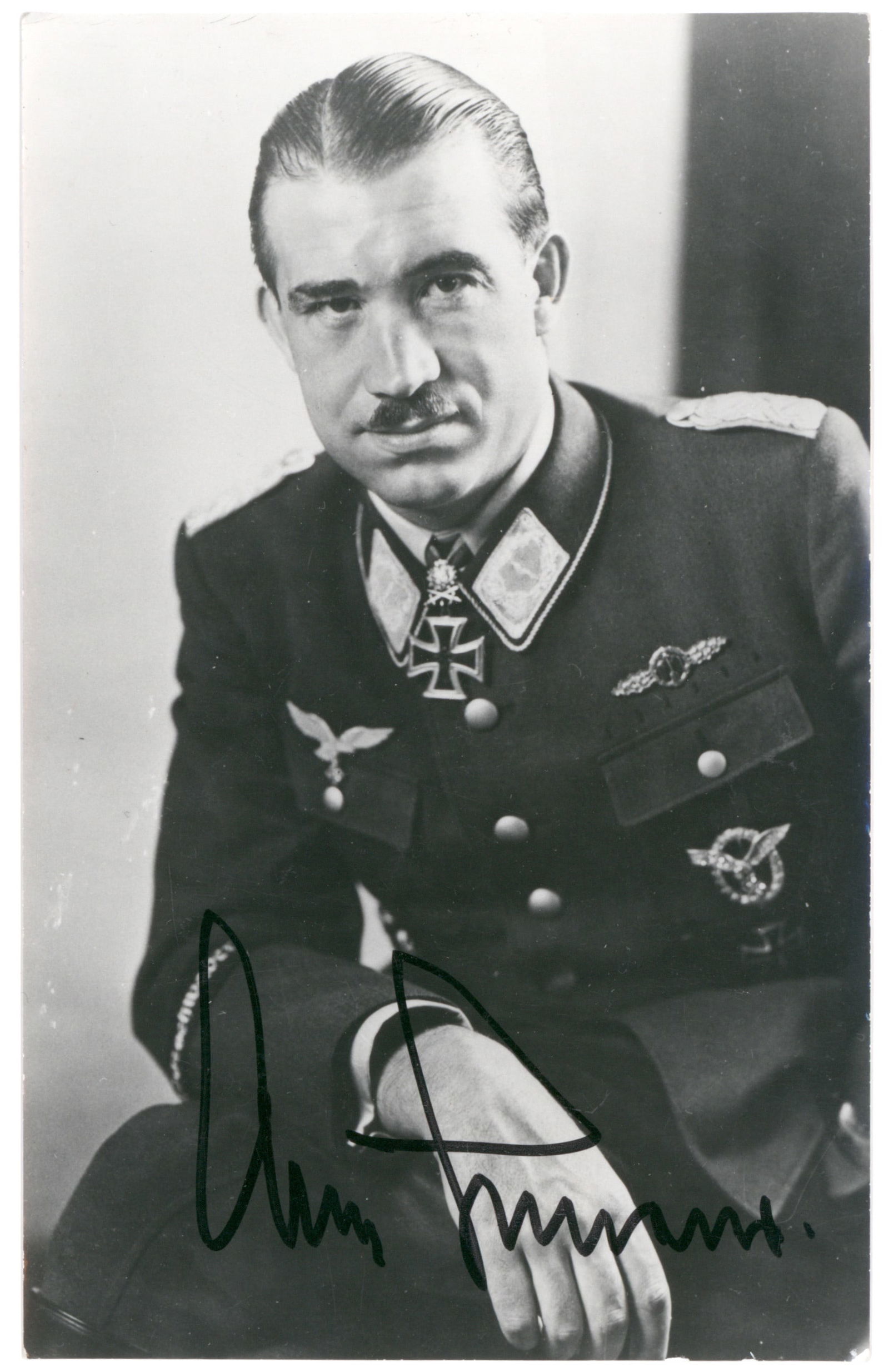 ADOLF GALLAND: (1911 - 1994) German fighter ace of World War II and general of fighters. Fine, almost certainly war-date S.P., 4 x 6.5 in. b/w, a casual half-length portrait in uniform, boldly signed.