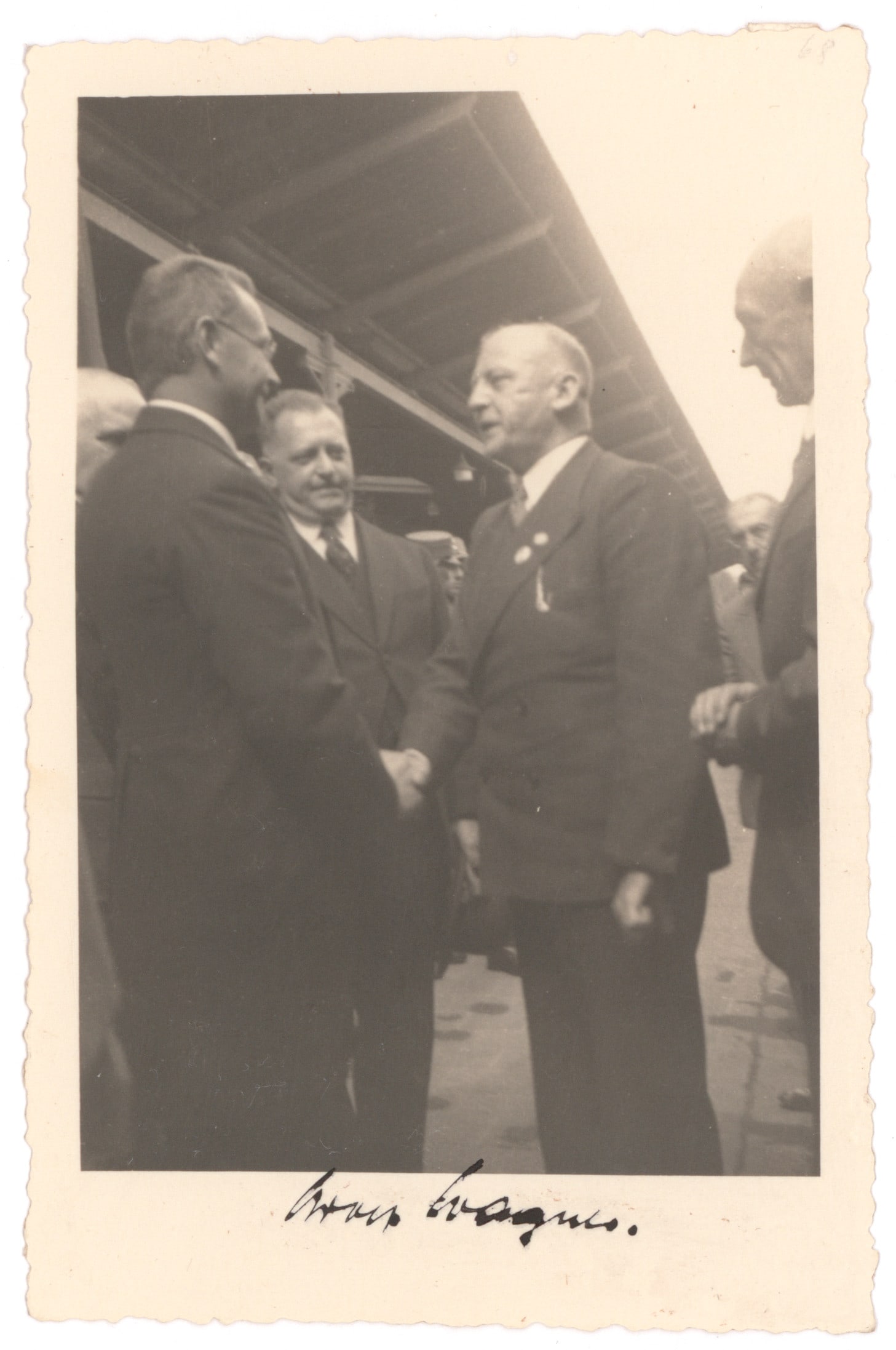 ADOLF WAGNER: (1890 - 1944) Gauleiter and Deputy Prime Minister of Bavaria and a leader in the 'Night of the Long Knives'. S.P., 3.5 x 5.25 in. b/w, a candid photograph of Wagner greeting several men, signed in