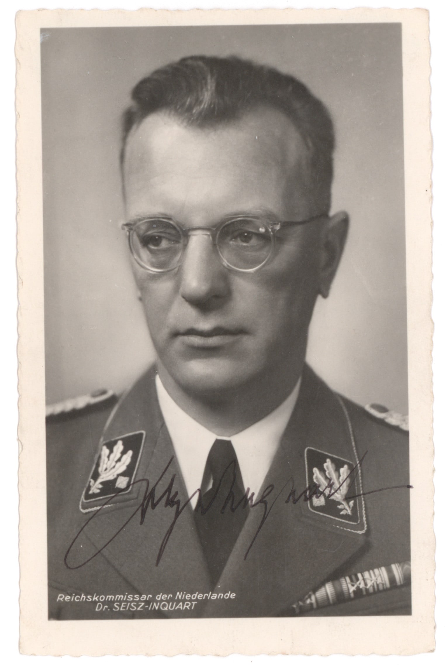 ARTHUR SEYSS-INQUART: (1892 - 1946) Nazi occupation governor of Holland and deputy governor of Poland, executed as war criminal. Fine war-date S.P., 3.5 x 5.5 b/w, a Hoffmann portrait photo in uniform, exuberantly signed i