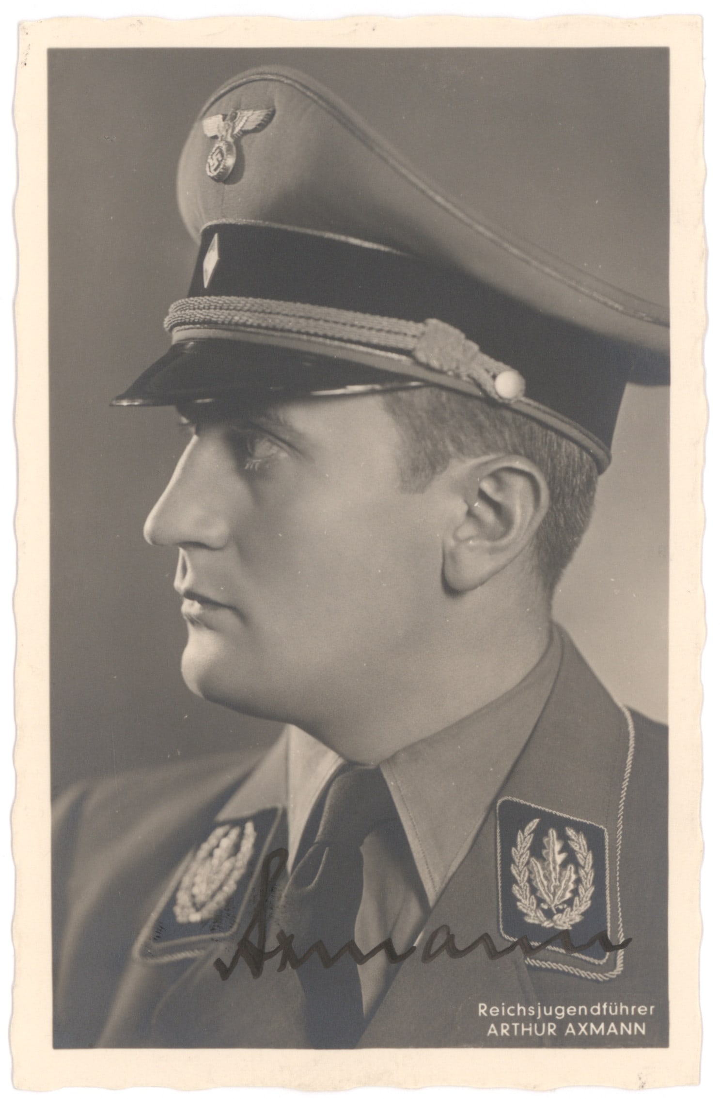 ARTUR AXMANN: (1913 - 1996) German Nazi national leader (Reichsjugendfuhrer) of the Hitler Youth from 1940 to the war's end in 1945. Fine vintage S.P. 3.5 x 5.5 in. b/w, a Hoffmann real-photo postcard showing Axman