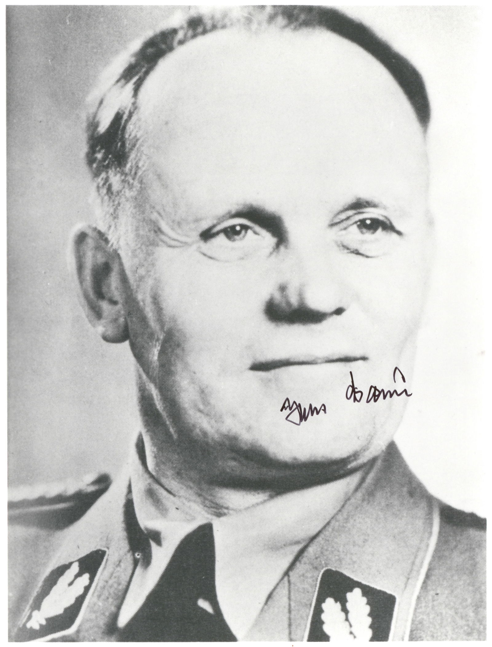 HANS BAUR: (1897-1993) German Luftwaffe pilot, private pilot to Adolf Hitler. S.P., 8 x 10 in. b/w, a portrait of Baur in SS uniform, signed in black ink across his visage. Fine condition.