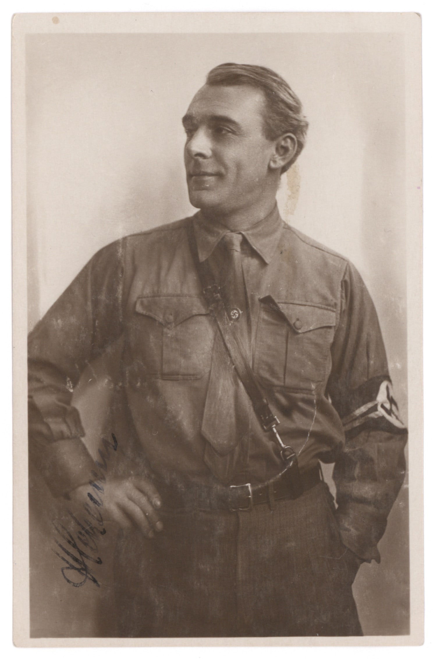 HANS SCHEMM: (1891 - 1935) NSDAP Gauleiter Bayerische Ostmark, SA Gruppenfuhrer and bavarian minister of culture. Excellent S.P. 3 1/2 x 5 1/2" half-length postcard photo in S.A. uniform, signed in ink at left.