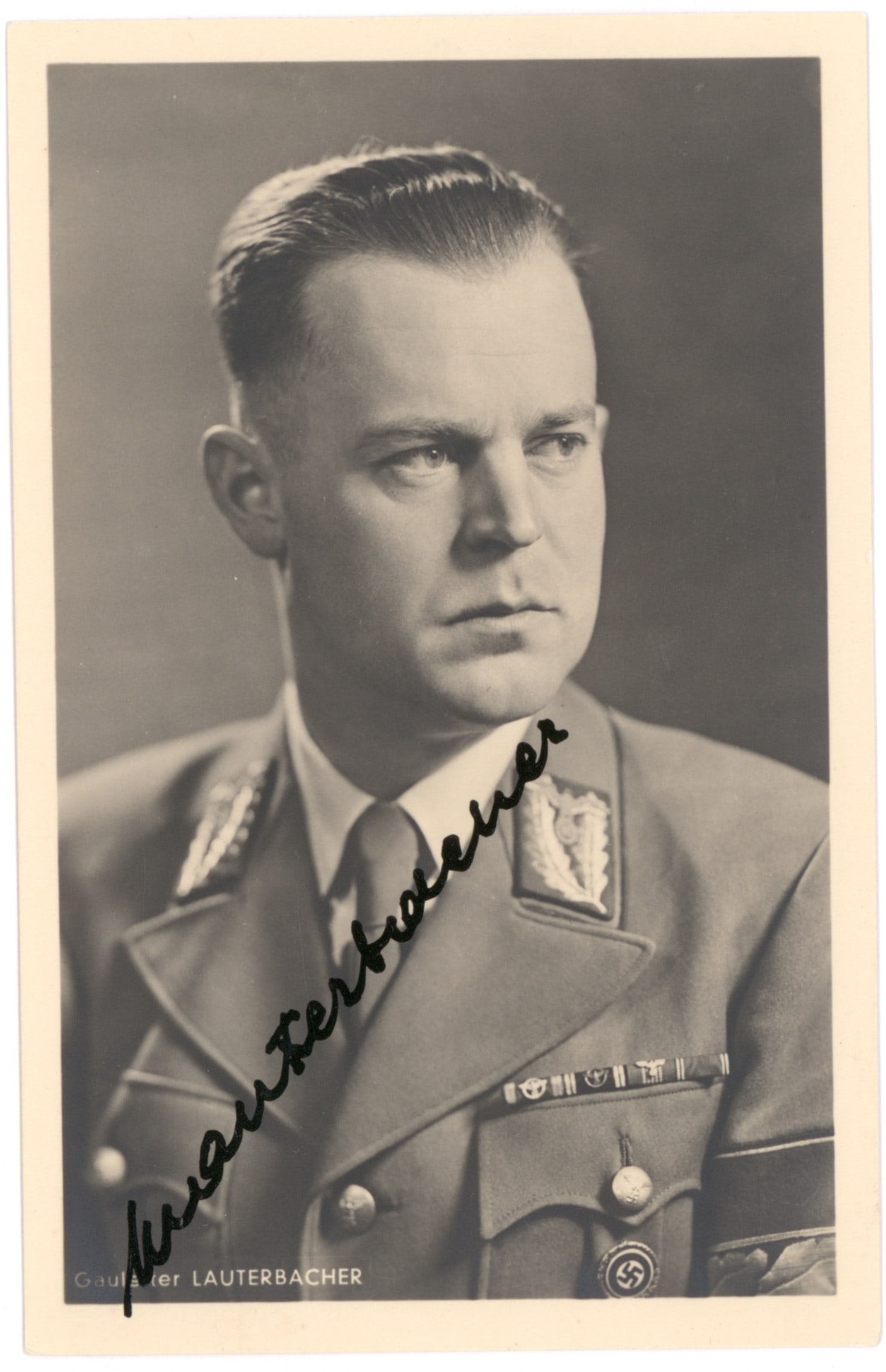 HARTMANN LAUTERBACHER: (1909 - 1988) Gauleiter of South Hanover-Braunschweig and an SS Gruppenführer, he later developed ratlines that helped Nazis escape Europe. Rare S.P., 3.5 x 5.5 in. b/w by Hoffmann, a chest-up po
