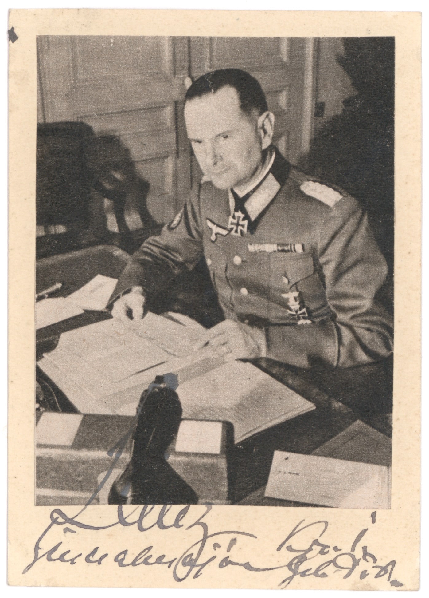 HUBERT LANZ: (1896-1982) Wehrmacht General of Mountain Troops, convicted of war crimes for atrocities committed in the Balkans. War-date S.P., 3.25 x 4.75 in. b/w, a pose in uniform seated at his desk, boldly sign