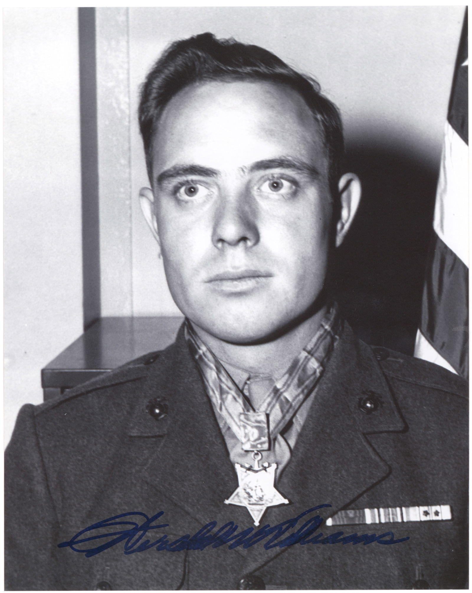 (IWO JIMA): HERSHEL WILLIAMS (1923-2022) Medal of Honor recipient for his actions at the Battle of Iwo Jima during World War II. S.P., 8 x 10 in. b/w, a reprint of a vintage image depicting the beach of Iwo Jima