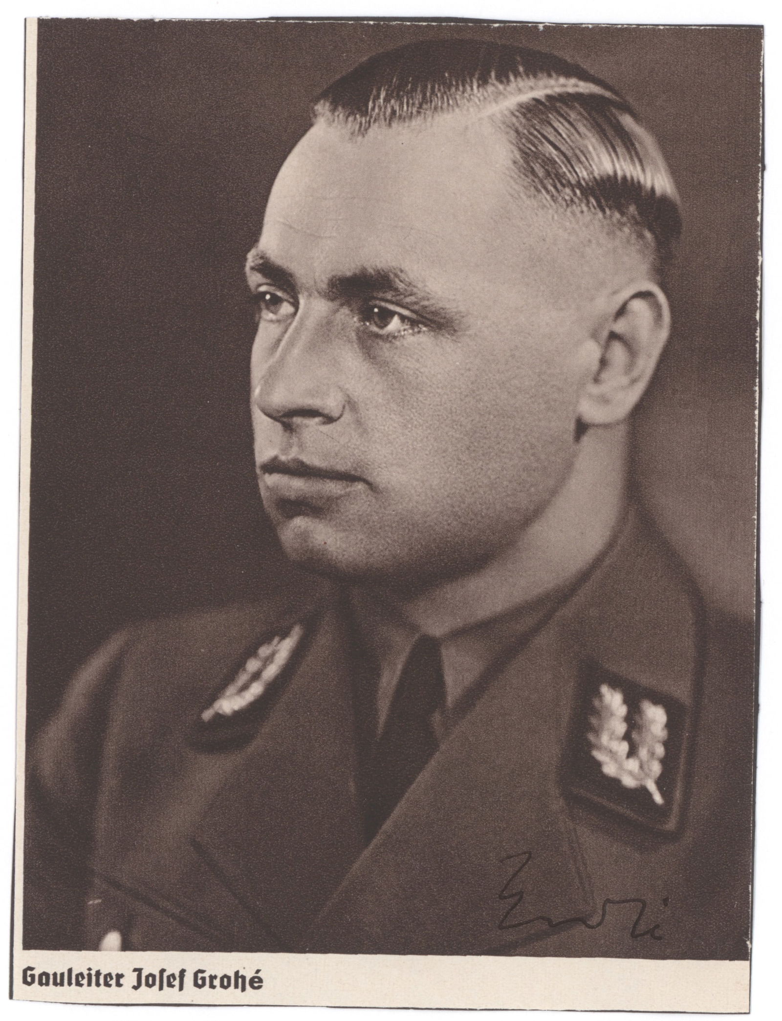 JOSEF GROHE: (1902 -1987) NSDAP Gauleiter of Cologne and Reichskommissariat of Belgium and Northern France. S.P., 4.75 x 6.5 in. sepia, a portrait in uniform on printed stock, signed at bottom. Mounted, fine