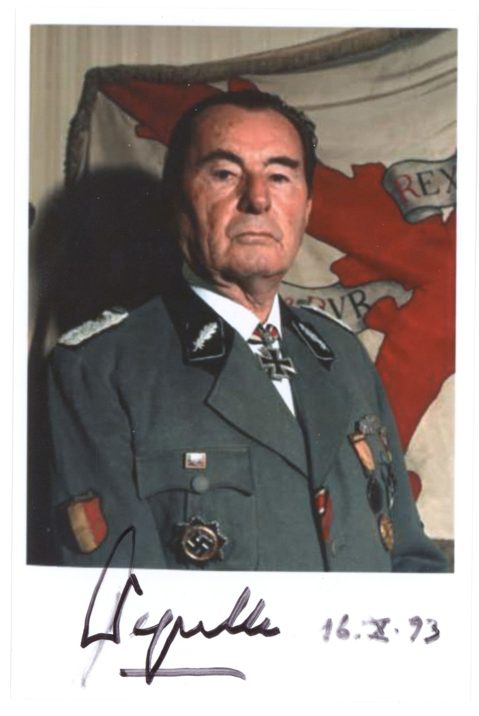 LEON DEGRELLE: (1906 - 1994) German soldier and close friend of Hitler, a Belgian volunteer in the German Army, he escaped to Spain at war's end. S.P. 4 x 6 in. color, showing Degrelle in uniform. Boldly signed at