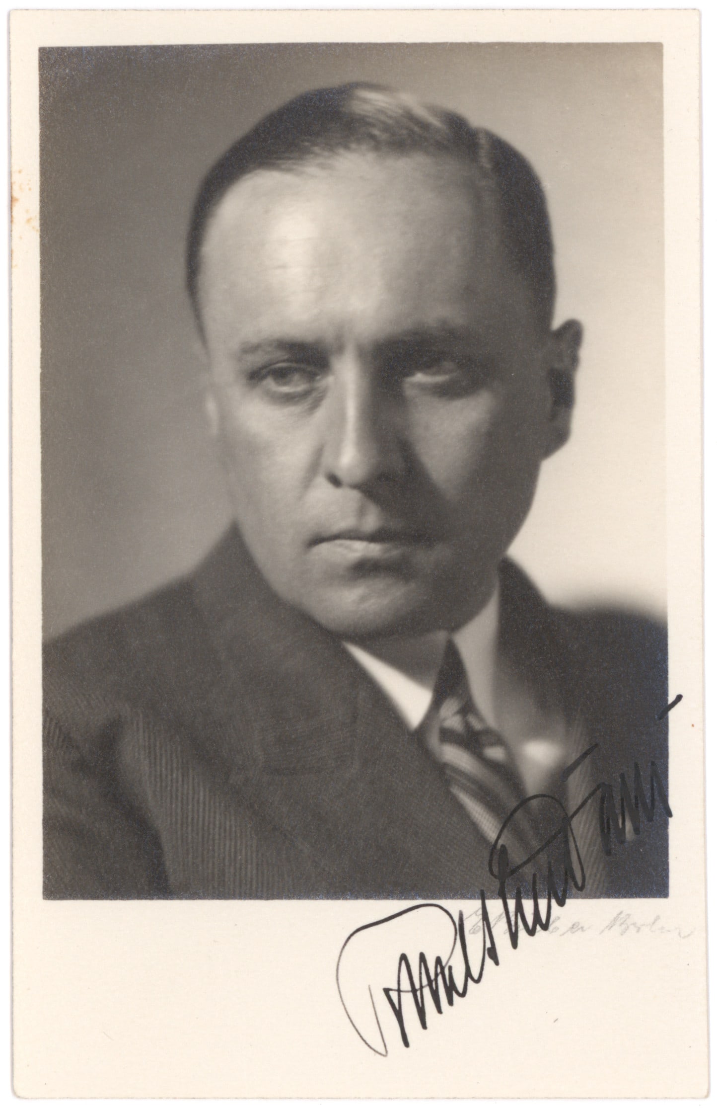RICHARD-WALTHER DARRE: (1895 - 1953) Nazi Minister of Food and head of the Central Office of Race and Resettlement of the SS. Fine S.P., 3.5 x 5.5 b/w, a chest, up pose in civilian garb, nicely signed across the white