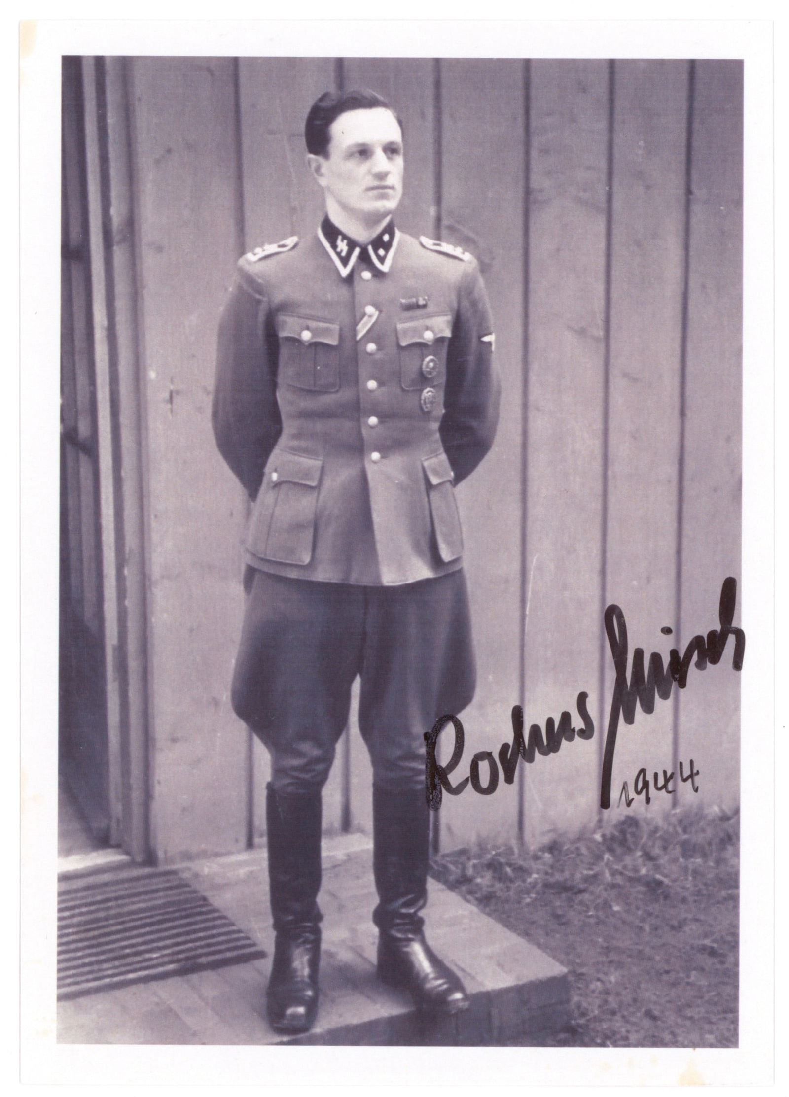 ROCHUS MISCH: (1917-2013) Oberscharfuhrer in the 1st SS Div. Leibstandarte SS Adolf Hitler, served as a courier, bodyguard and telephone operator for Adolf Hitler. S.P. 4 x 6 in. b/w, a reprint of a war-date image
