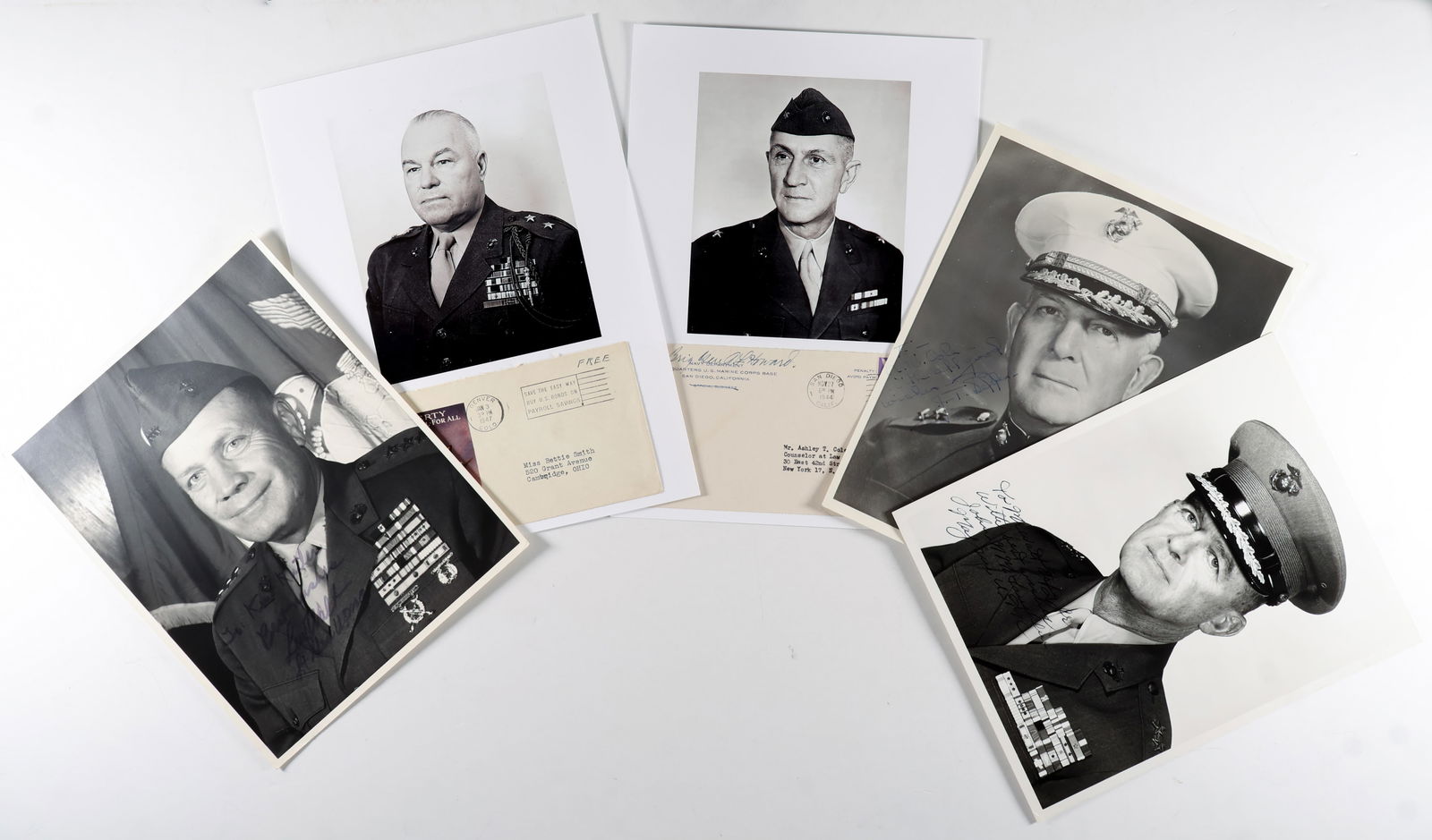 WORLD WAR II MARINE CORPS GENERALS (5): A good lot of seven pieces signed by prominent World War II Marine commanders, in various formats (noted). Includes: JOHN N. MCLAUGHLIN (I.S.P. 8 x 10 in. b/w, a formal portrait in uniform, signed