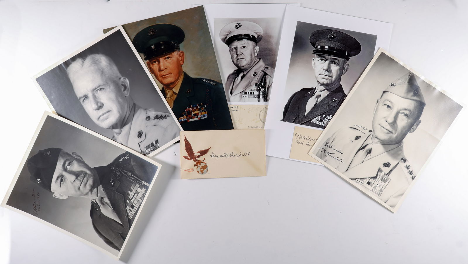WORLD WAR II MARINE CORPS GENERALS (6): A good lot of six pieces signed by prominent World War II Marine commanders, in various formats (noted). Includes: LOUIS R. JONES (bold signature and free frank on a postal, canceled Aug. 14, 1945